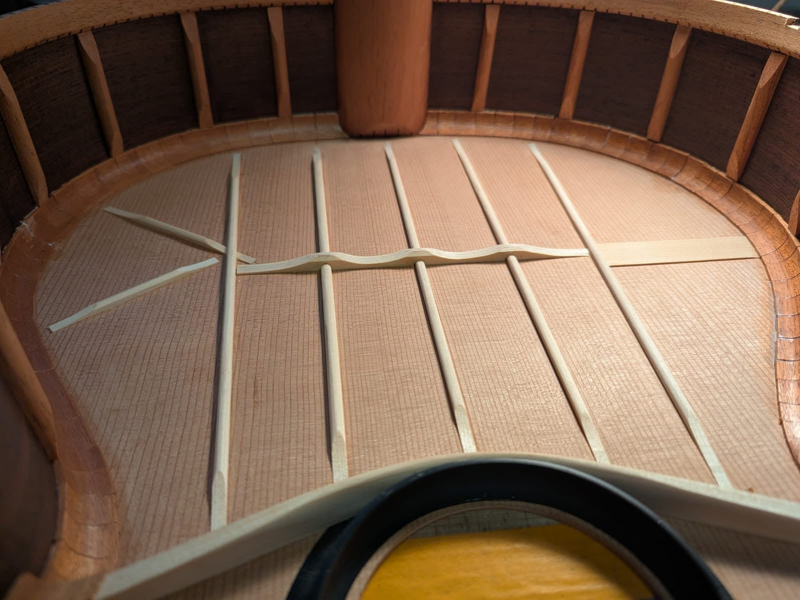 Fan braces and the scalloped cross bar
